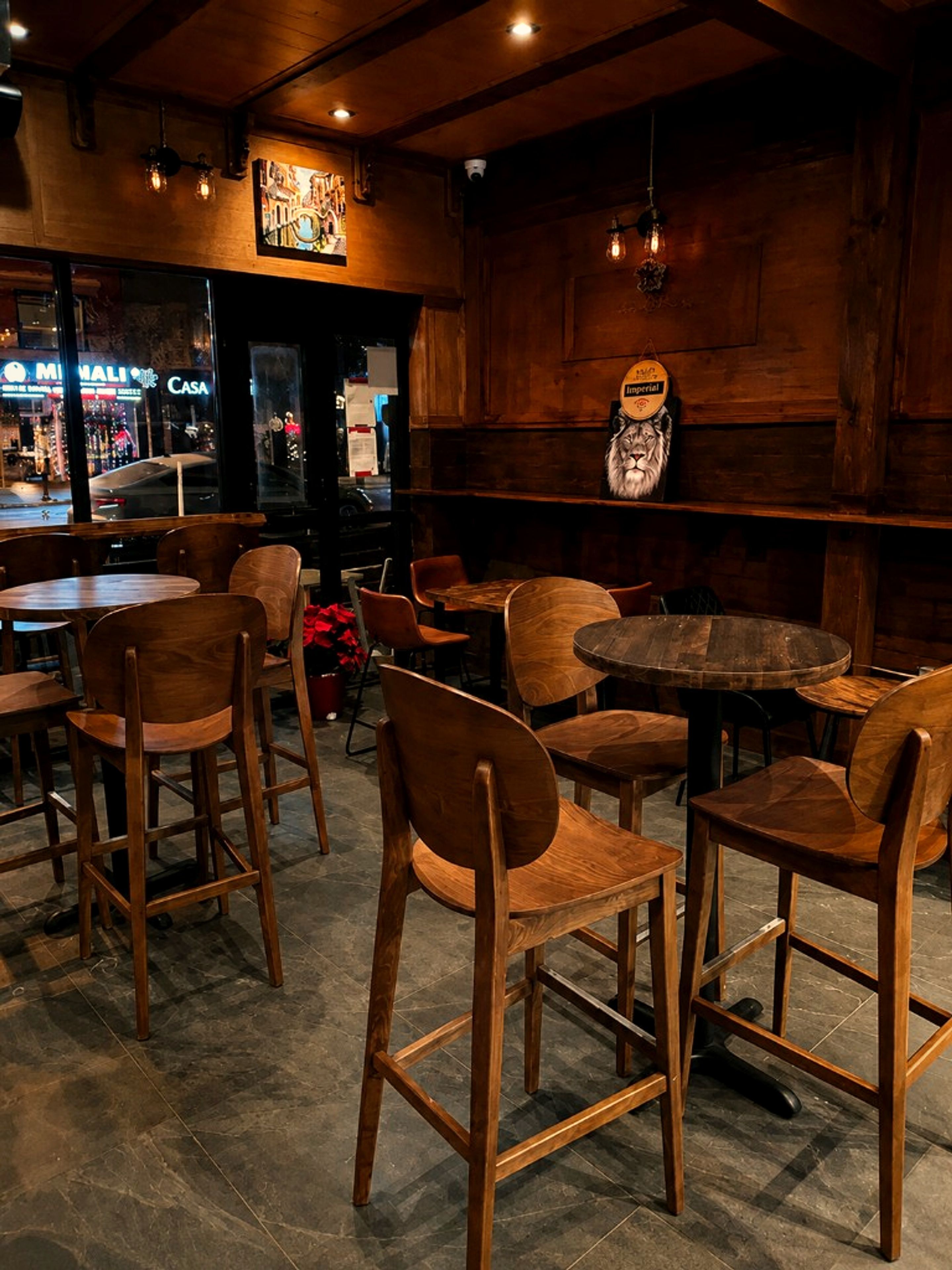 Warm wooden interior seating inside One Gram Coffee Bar on Danforth Avenue