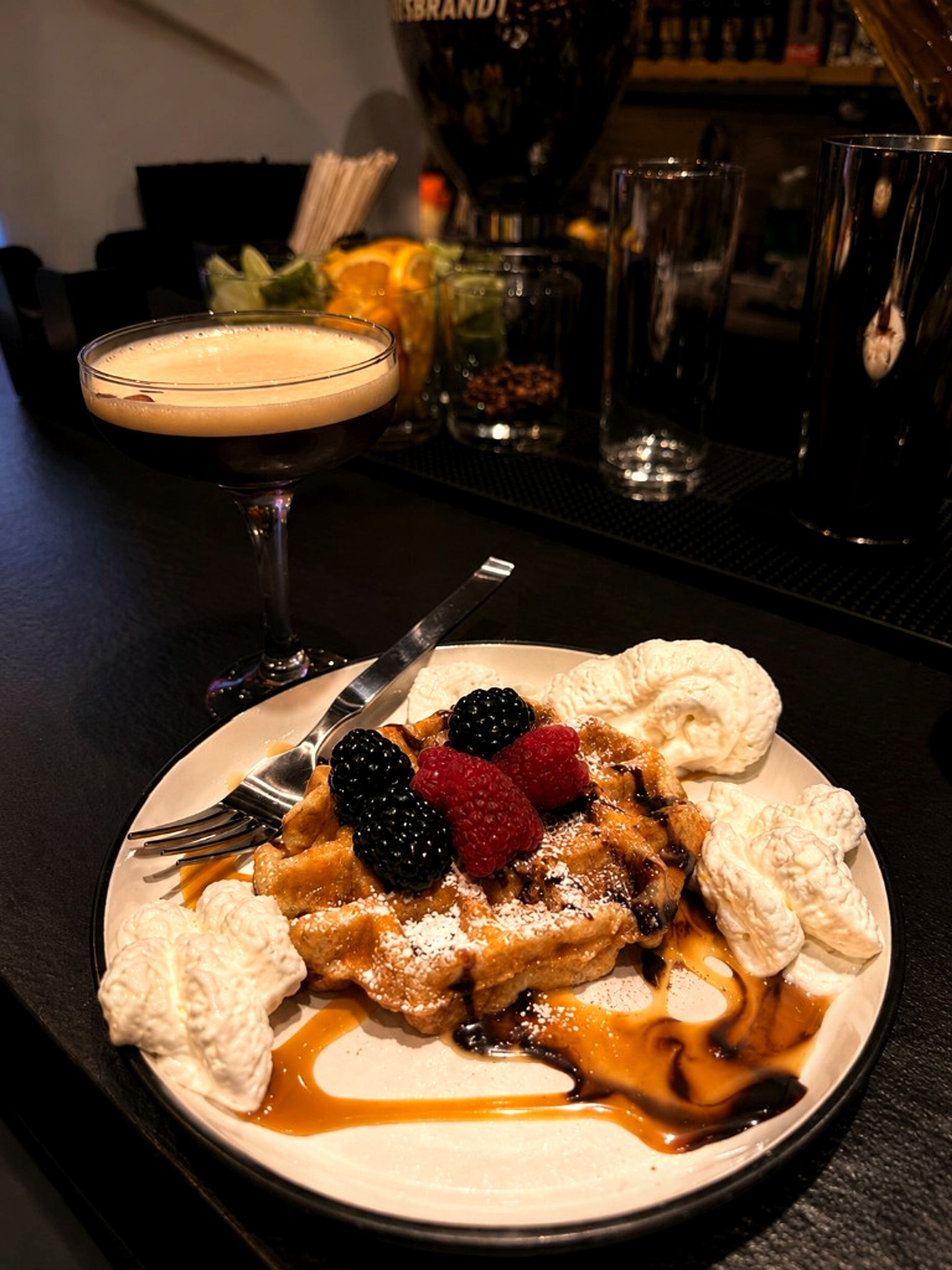 Waffle dessert and espresso martini cocktail at One Gram Coffee Bar